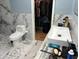 Bathroom with marble tile, modern vanity and walk-in closet at 5309 Good St, North Charleston, SC 29406