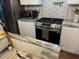 Modern kitchen with stainless steel appliances and granite countertops at 5309 Good St, North Charleston, SC 29406
