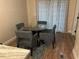 Bright dining area with glass table and four gray chairs at 5309 Good St, North Charleston, SC 29406