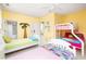 Well-lit bedroom with two twin beds and access to a full bath at 1311 S Jenkins Lagoon Dr, Seabrook Island, SC 29455