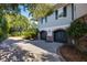Two-car garage with brick facade and spacious driveway at 1311 S Jenkins Lagoon Dr, Seabrook Island, SC 29455