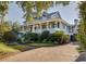 Two-story home with large porch and lush landscaping at 1311 S Jenkins Lagoon Dr, Seabrook Island, SC 29455