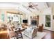 Spacious living room with vaulted ceilings, fireplace, and hardwood floors at 1311 S Jenkins Lagoon Dr, Seabrook Island, SC 29455