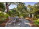 Enjoy the outdoors on this stone patio with seating area, surrounded by beautiful landscaping at 1311 S Jenkins Lagoon Dr, Seabrook Island, SC 29455
