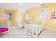 Charming bedroom with twin beds, bunk bed, and plenty of natural light at 1311 S Jenkins Lagoon Dr, Seabrook Island, SC 29455