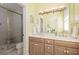 Bright bathroom with double vanity, shower, and toilet at 1311 S Jenkins Lagoon Dr, Seabrook Island, SC 29455