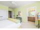 Bedroom with ensuite bath and light yellow walls at 1311 S Jenkins Lagoon Dr, Seabrook Island, SC 29455