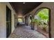 Covered brick pathway with arched entryways and lush landscaping at 1311 S Jenkins Lagoon Dr, Seabrook Island, SC 29455