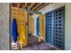Bright, yellow outdoor shower with blue accents and privacy screen at 1311 S Jenkins Lagoon Dr, Seabrook Island, SC 29455