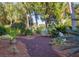 Relaxing garden retreat with lush landscaping and comfortable seating at 1311 S Jenkins Lagoon Dr, Seabrook Island, SC 29455