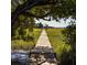 Long wooden walkway extending over marsh grasses toward a distant shoreline at 1311 S Jenkins Lagoon Dr, Seabrook Island, SC 29455