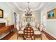 Elegant dining room with hardwood floors and a chandelier at 1311 S Jenkins Lagoon Dr, Seabrook Island, SC 29455