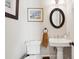 Charming bathroom with pedestal sink, toilet, and decorative accents at 738 Hibbens Grant Blvd, Mount Pleasant, SC 29464