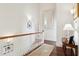 Upstairs hallway with hardwood floors, a large mirror, and a console table at 738 Hibbens Grant Blvd, Mount Pleasant, SC 29464