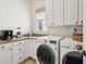 Bright laundry room with washer, dryer and additional counter space at 738 Hibbens Grant Blvd, Mount Pleasant, SC 29464