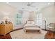 Charming bedroom with hardwood floors, a cozy bed, and ample natural light at 738 Hibbens Grant Blvd, Mount Pleasant, SC 29464