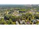 An aerial view showcasing a beautiful neighborhood with tree-lined streets and various house styles at 738 Hibbens Grant Blvd, Mount Pleasant, SC 29464