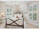Charming bedroom with a metal bed frame and window with shutters at 738 Hibbens Grant Blvd, Mount Pleasant, SC 29464