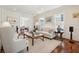 Living room with hardwood floors, comfortable seating, and a chandelier at 738 Hibbens Grant Blvd, Mount Pleasant, SC 29464