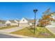 House exterior with driveway, landscaping, and street view at 176 Garden Gate Way, Summerville, SC 29486