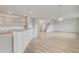 Open concept kitchen with island, granite countertops, and stainless steel appliances at 1866 Nola Run, Summerville, SC 29485