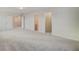 Spacious bedroom with carpet flooring and access to a bathroom and closet at 1866 Nola Run, Summerville, SC 29485