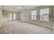 Bright bedroom with plush carpet, double doors, and ample natural light at 1866 Nola Run, Summerville, SC 29485