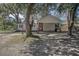 House exterior with mature trees and carport at 311 Black St, Walterboro, SC 29488