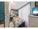 Small bedroom with twin bed and wicker dresser at 115 Galloway Ct, Moncks Corner, SC 29461