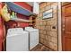 Convenient laundry area with washer, dryer, and built-in shelving at 115 Galloway Ct, Moncks Corner, SC 29461