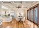 Elegant dining room with hardwood floors, coffered ceiling, and access to the patio at 104 Beach St, Mount Pleasant, SC 29464