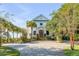 Front view of charming two-story home with landscaping at 104 Beach St, Mount Pleasant, SC 29464