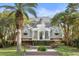 Grand home with circular driveway and lush landscaping at 140 Flyway Dr, Kiawah Island, SC 29455