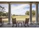 Relaxing porch with rocking chairs overlooking golf course at 140 Flyway Dr, Kiawah Island, SC 29455