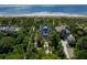 Aerial view of a stunning beachfront home with lush landscaping at 140 Flyway Dr, Kiawah Island, SC 29455