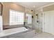 Bathroom with soaking tub and walk-in shower at 2202 Folly Rd, Charleston, SC 29412