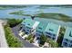 Aerial view of waterfront property, showing three-story homes with green roofs at 2202 Folly Rd, Charleston, SC 29412