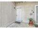 Front door entry with a welcome mat and potted plant at 202 Greenmeadow Dr, Goose Creek, SC 29445
