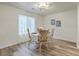 Bright dining room with table, chairs, and large window at 202 Greenmeadow Dr, Goose Creek, SC 29445