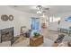 Living room with fireplace and view of dining area at 202 Greenmeadow Dr, Goose Creek, SC 29445