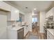 Modern kitchen with white cabinets and stainless steel appliances at 202 Greenmeadow Dr, Goose Creek, SC 29445