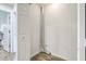 Small laundry room with whitewashed walls and wood-look flooring at 202 Greenmeadow Dr, Goose Creek, SC 29445