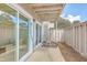 Private patio with small table and chairs, adjacent to sliding glass doors at 202 Greenmeadow Dr, Goose Creek, SC 29445
