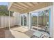 Private patio with small table and chairs, adjacent to sliding glass doors at 202 Greenmeadow Dr, Goose Creek, SC 29445