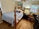 Charming bedroom with a wooden bed frame, light blue bedding, and a work area at 2330 S Lander Ln, Charleston, SC 29414