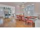 Open concept dining area with hardwood floors and a view into the kitchen at 413 King St, Mount Pleasant, SC 29464