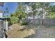 Fenced backyard with grassy area and mature trees at 413 King St, Mount Pleasant, SC 29464