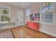 Light and airy entryway with coral dresser and hardwood floors at 413 King St, Mount Pleasant, SC 29464