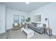 Cozy living room with gray sofa, white coffee table, and two armchairs at 601 Twin Rivers Dr, Wando, SC 29492
