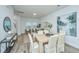 Open living room and dining area with hardwood floors at 601 Twin Rivers Dr, Wando, SC 29492